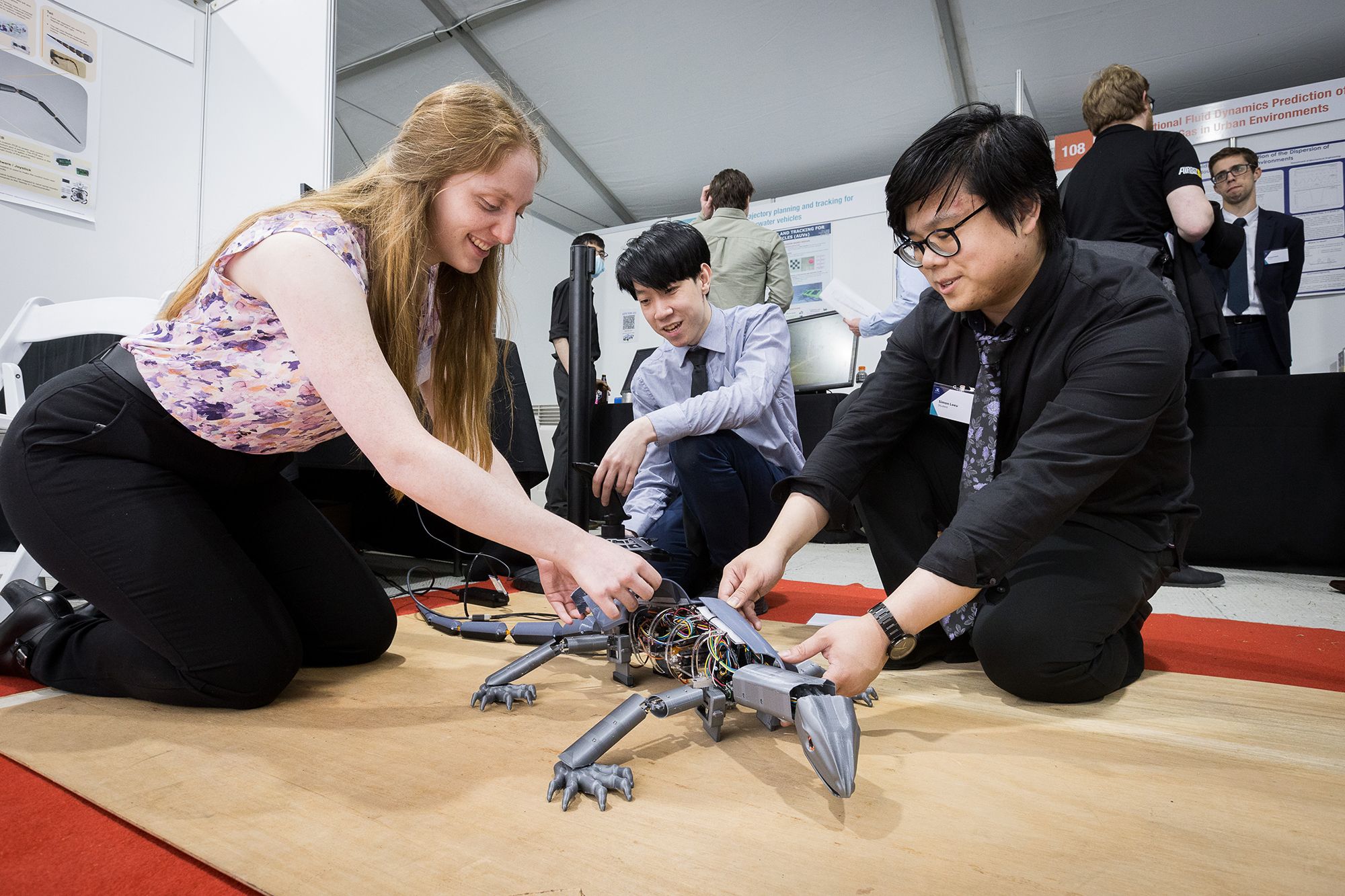 Students working on a robot lizard.